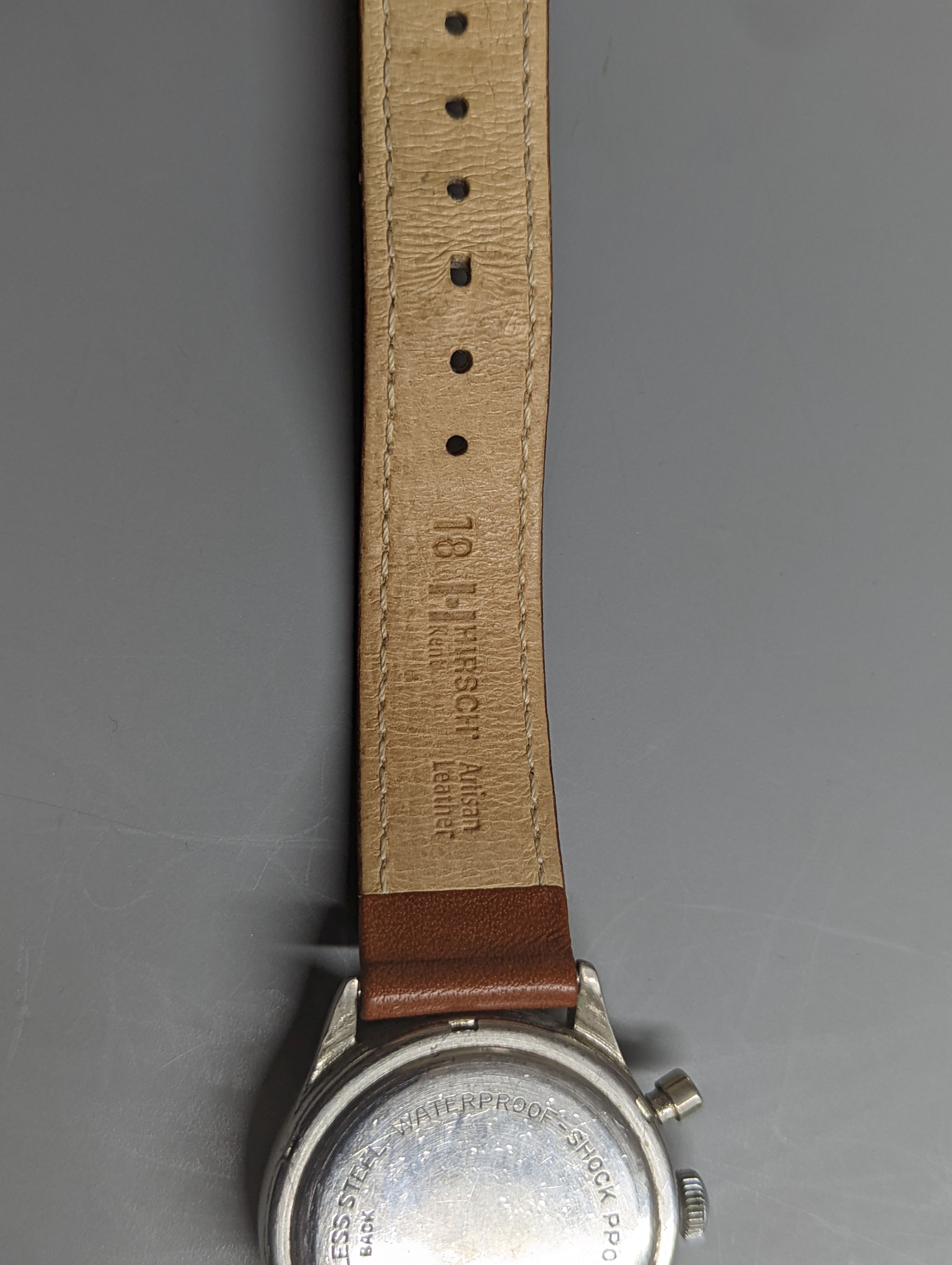 A gentleman's stainless steel Baume & Mercier Chronographe wrist watch, with Arabic numerals and two subsidiary dials, case diameter 35mm, on a later associated leather strap.